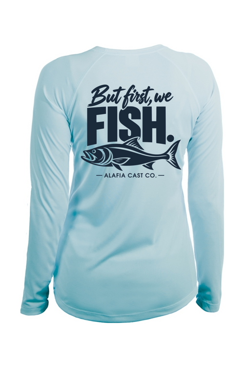 Back of Alafia Cast Co. But First We Fish women’s shirt in Arctic Blue, with navy lettering and a fish graphic