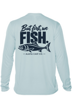 Back of Alafia Cast Co. But First We Fish men’s shirt in Arctic Blue, with navy lettering and a fish graphic