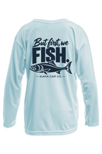 Back of Alafia Cast Co. But First We Fish youth shirt in Arctic Blue, with navy lettering and a fish graphic