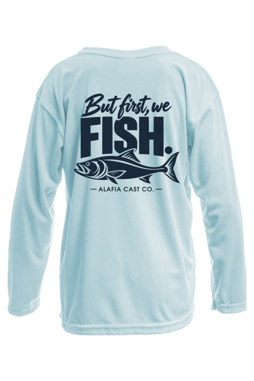 Back of Alafia Cast Co. But First We Fish youth shirt in Arctic Blue, with navy lettering and a fish graphic
