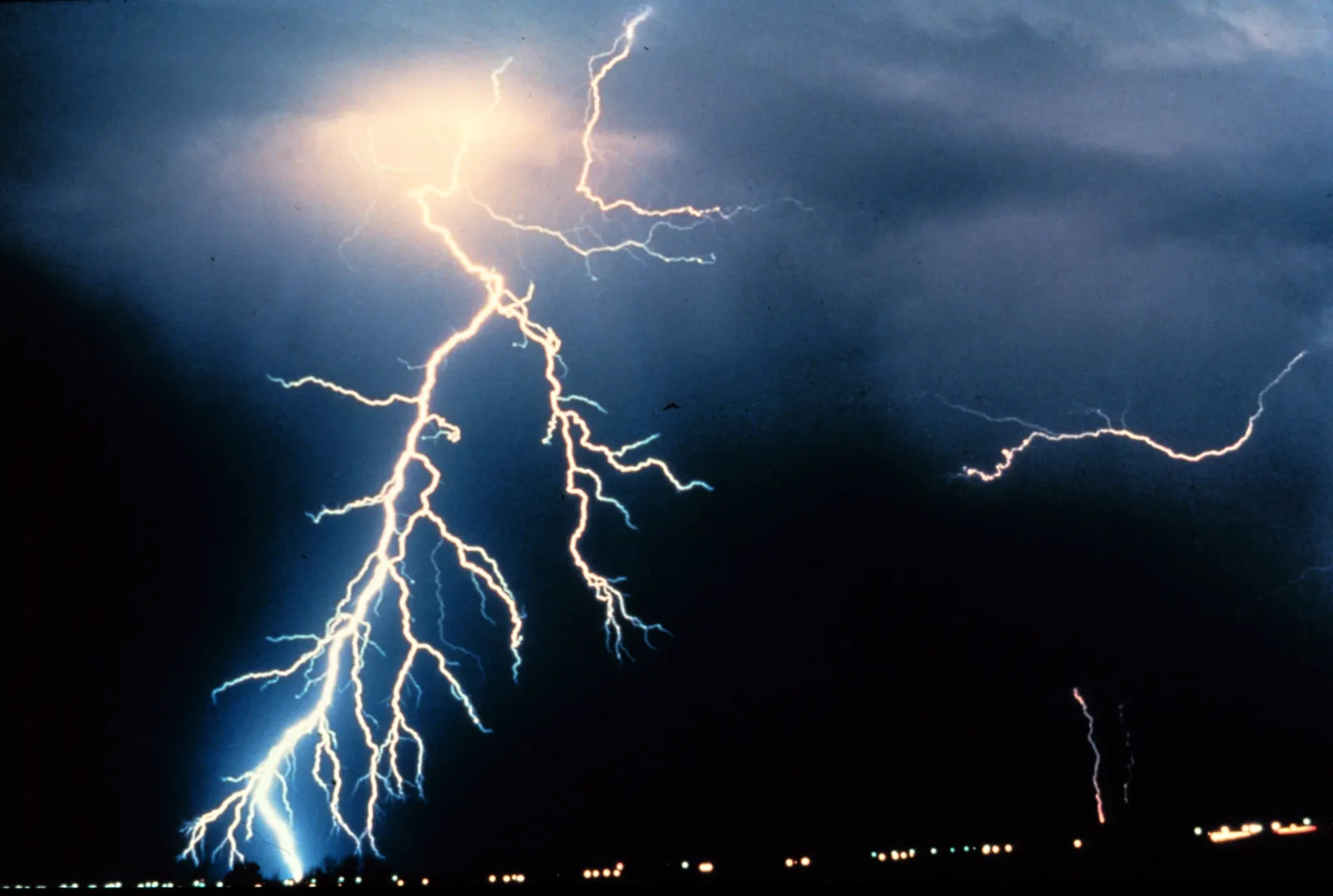 Several lightning bolts striking during a night thunderstorm